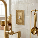 Gatsby Collection brushed gold toggle switch plate in a kitchen