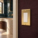 Signature 1G Rocker switch plate in Brushed Brass - lifestyle