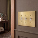 Forge 3G Toggle Wall Plate | Brushed Gold - lifestyle