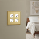 Deco 2-gang duplex outlet cover in Brushed Brass, photo 2 - lifestyle