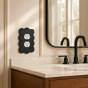 Scallop 1G Duplex Wall Plate in Black in a bathroom
