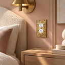 Botanical Garden 1G Duplex Wall Plate in Brushed Gold in a bedroom