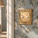 Botanical Garden 2G Toggle Wall Plate in Brushed Gold in a hallway