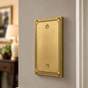 Pearl 1-gang blank wall plate in Brushed Gold, lifestyle pho