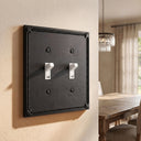 Pearl 2-gang toggle wall plate in Black, lifestyle photo