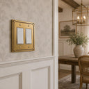Pearl 2-gang rocker wall plate in Brushed Gold, lifestyle ph