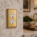 Pearl 1-gang duplex wall plate in Brushed Gold, lifestyle photo