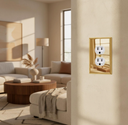 Gold duplex outlet cover in a sunlit living room