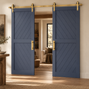Two navy barn doors meeting in the middle on one Light Gold double door track, in a warm living room doorway