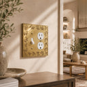 Floral 2G TD Combo wall plate in Brushed Gold on a wall in a styled room