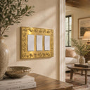 Floral 3G Rocker wall plate in Brushed Gold on a wall in a styled room