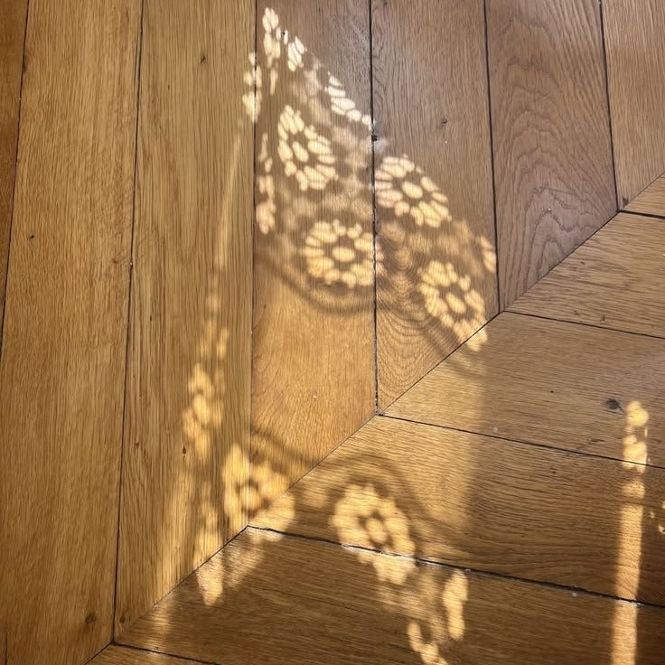 Lace shadow on a wood floor