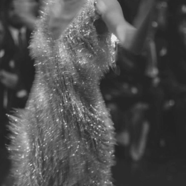Black and white fringe dress in motion