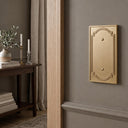 Heritage 1G Blank wall plate in Brushed Gold on a wall in a styled room
