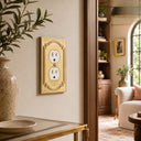 Heritage 1G Duplex wall plate in Brushed Gold on a wall in a styled room