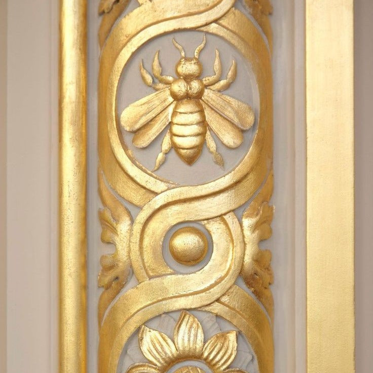 Gilded carved panel with a bee medallion