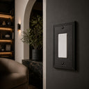 Imperial 1G Rocker wall plate in Black on a wall in a styled room