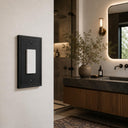 Imperial 1G Rocker wall plate in Black on a wall in a styled room