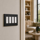 Imperial 4G Rocker wall plate in Black on a wall in a styled room