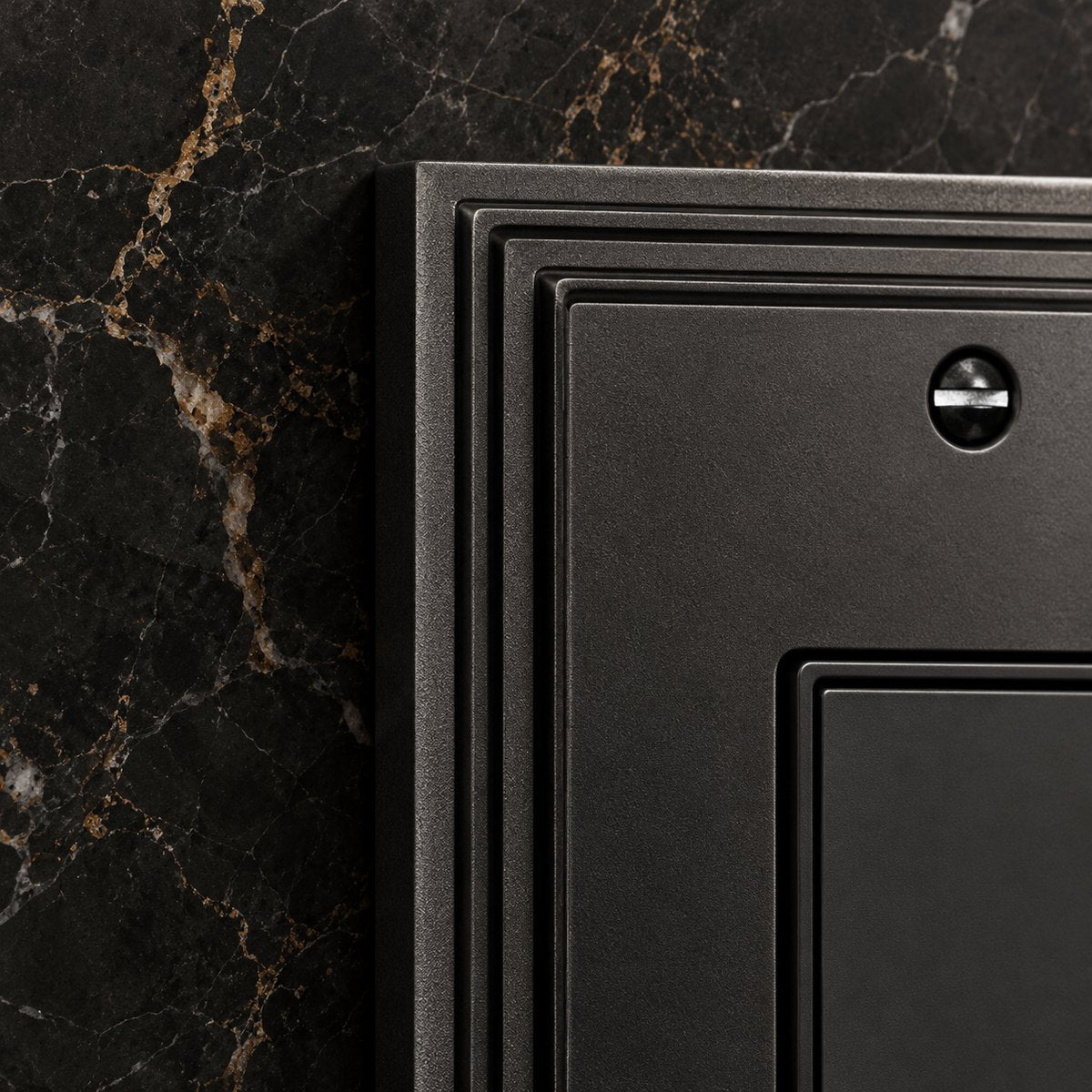 Close-up of an Imperial wall plate in Plain Black, showing the stepped edge