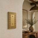 Laurel 1G Blank wall plate in Brushed Gold on a wall in a styled room