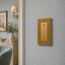 Laurel 1G Blank wall plate in Brushed Gold on a wall in a styled room