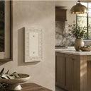 Laurel 1G Blank wall plate in Warm Ivory on a wall in a styled room
