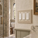 Laurel 3G Rocker wall plate in Warm Ivory on a wall in a styled room