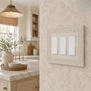 Laurel 3G Rocker wall plate in Warm Ivory on a wall in a styled room