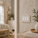 Laurel 3G Rocker wall plate in Warm Ivory on a wall in a styled room