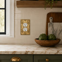 Nouveau 1G Duplex Wall Plate in Brushed Gold in a kitchen