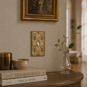 Nouveau 1G Toggle Wall Plate in Brushed Gold in a living room