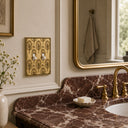 Nouveau 2G Toggle Wall Plate in Brushed Gold in a bathroom