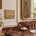 Nouveau 3G Toggle Wall Plate in Brushed Gold in a bathroom