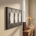 Pearl 3-gang rocker wall plate in Black, lifestyle photo