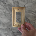 Estate Brushed Gold wall plate handled close up to show weight and finish