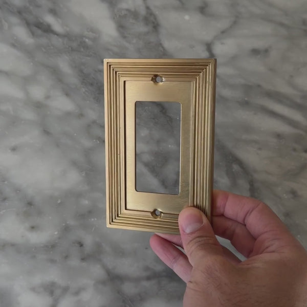 Estate Brushed Gold wall plate handled close up to show weight and finish