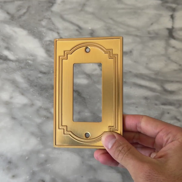 Heritage Brushed Gold wall plate handled close up to show weight and finish