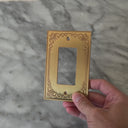 Palazzo Brushed Gold wall plate handled close up to show weight and finish