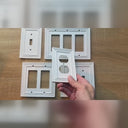 Estate wall plates in White shown in hand