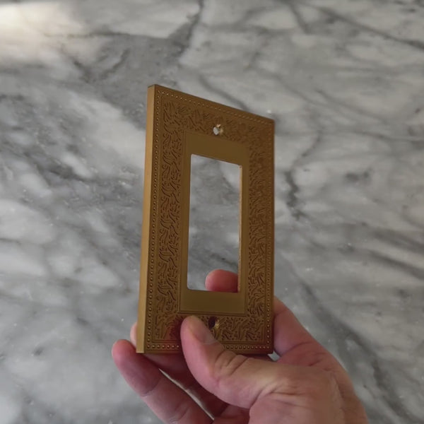 Laurel Brushed Gold wall plate handled close up to show weight and finish