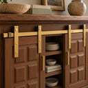Walnut credenza with two sliding doors on a Gold mini barn door rail, open in the middle to show shelves