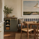Olive green cabinet with a Gold mini sliding barn door in a dining room