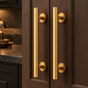 Gold round barn door handles on dark walnut doors