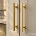 Light Gold round barn door handles on cream cabinet doors
