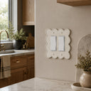 Scallop 2G Rocker Wall Plate in Warm Ivory in a kitchen