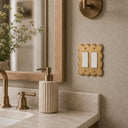 Scallop 2G Rocker Wall Plate in Brushed Gold in a bathroom