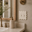 Scallop 2G Toggle Wall Plate in Warm Ivory in a bathroom