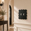 Scallop 2G Toggle wall plate in Black, lifestyle photo in an entryway