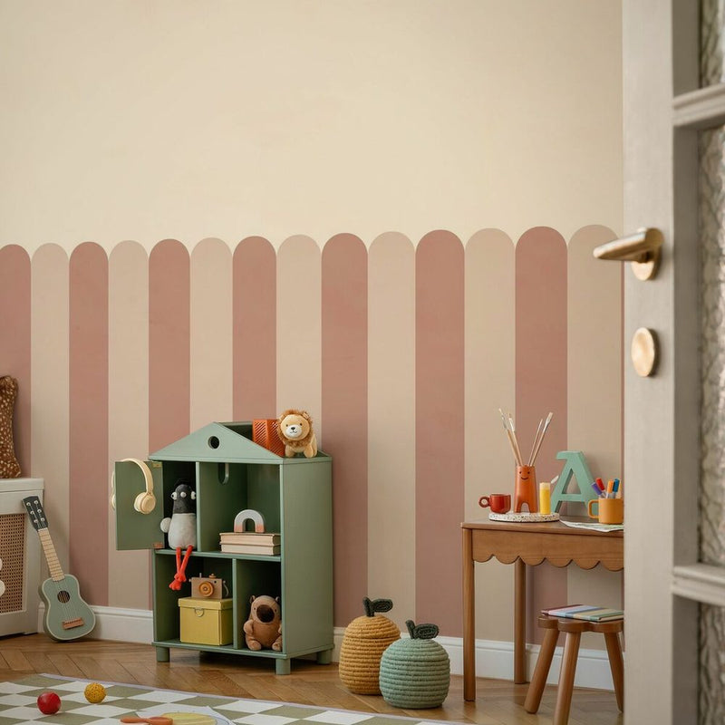 Children's room with a pink scalloped painted wall